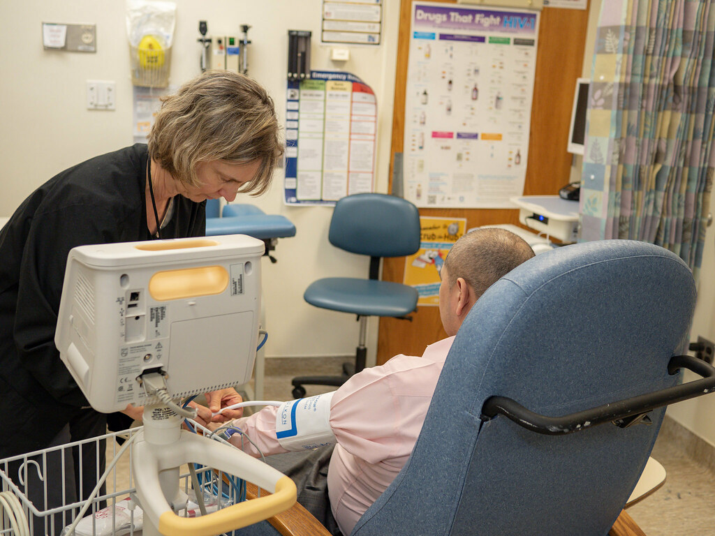 Clinical trial volunteer receiving a medical examination